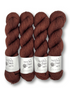 Four skeins of brown yarn with labels on a white background