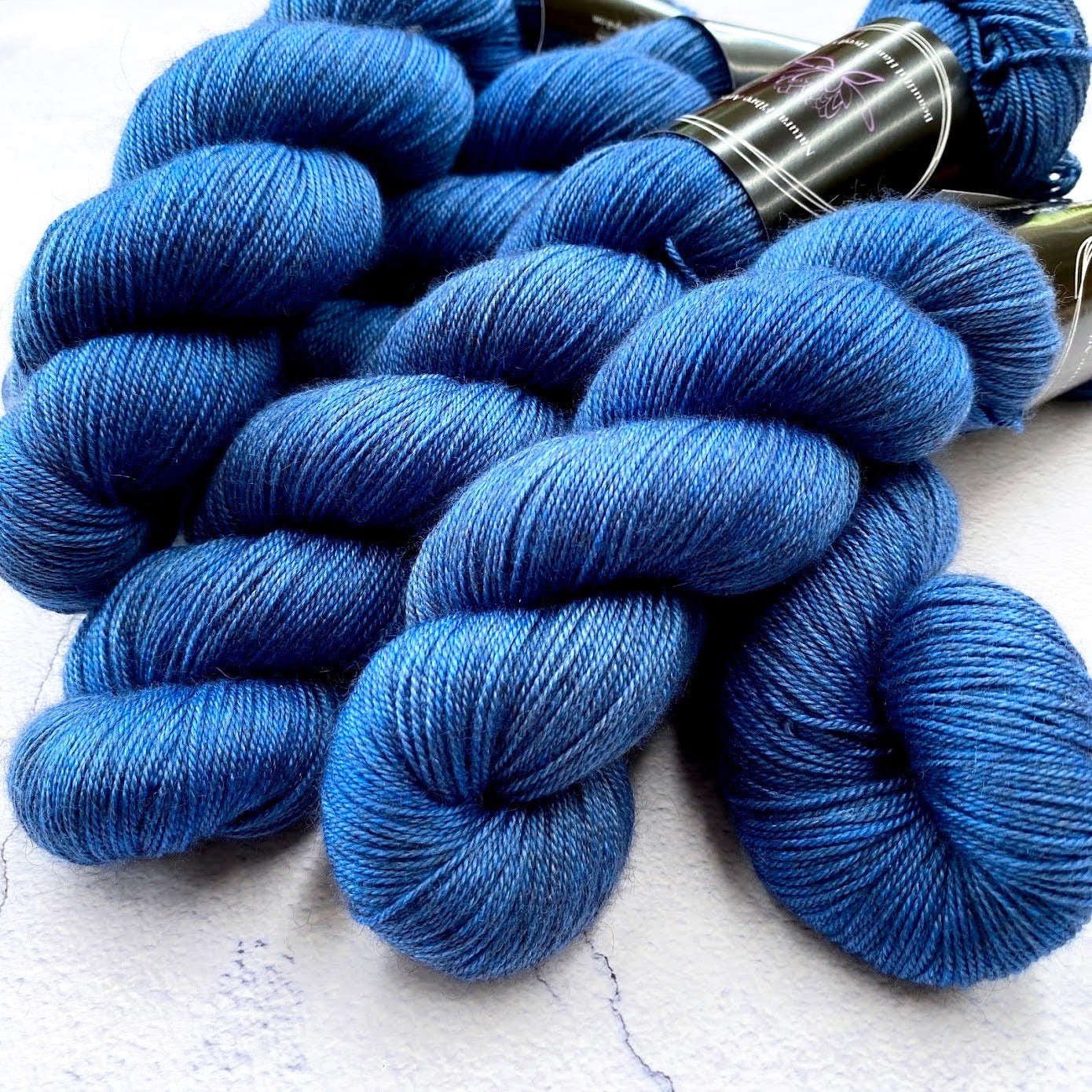 Hand dyed yarn. Bright blue, semi solid, hand dyed yarn on Merino Silk Yak fingering weight 4 ply yarn.